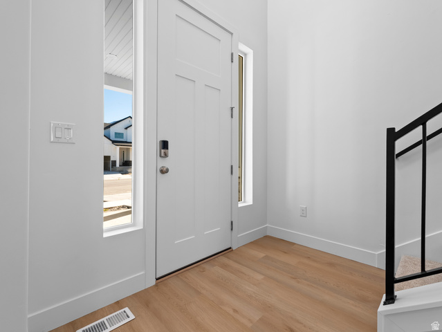 18 South Crimson Way, Unit 304 Mapleton, UT 84664 - Photo 4 of 17 Foyer with baseboards and light wood-style flooring