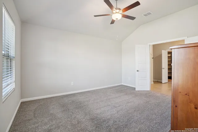 a bathroom with a double vanity sink toilet and shower
