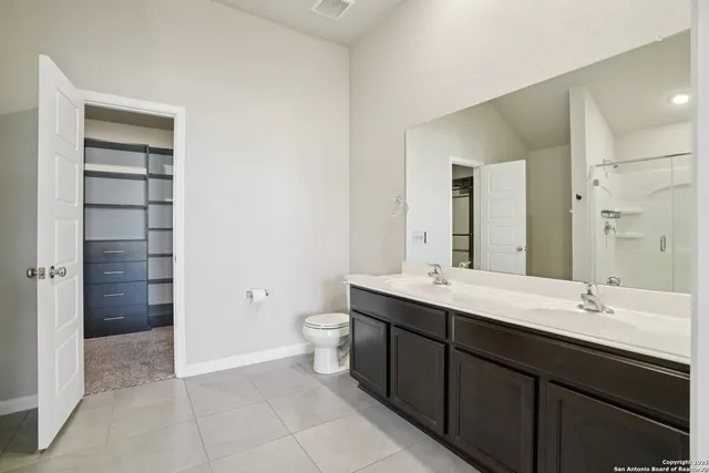 a view of a bathroom with a shower and a sink