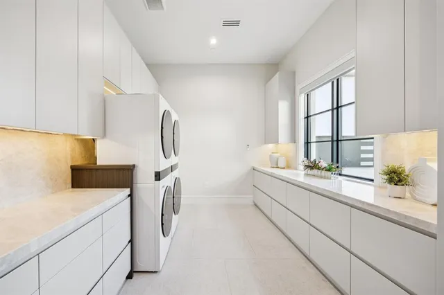 a kitchen with a sink and a stove top oven
