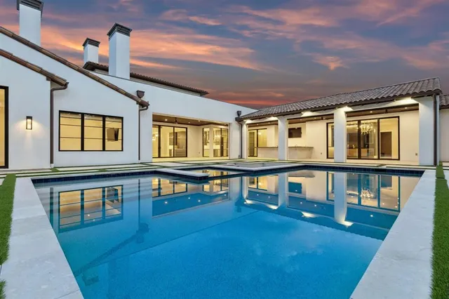 a view of residential house with roof deck