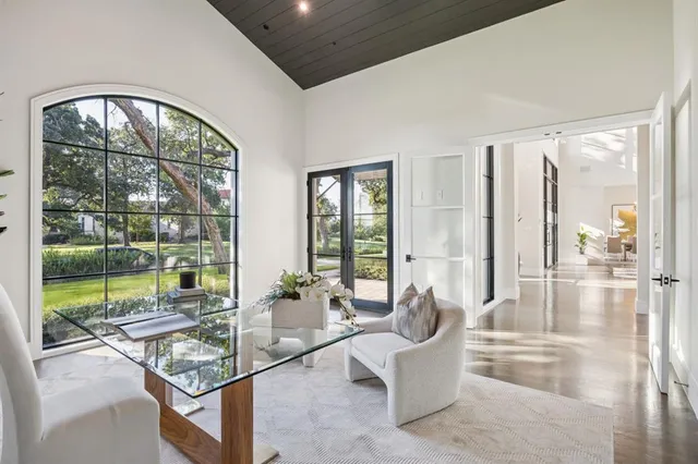 a living room with large windows