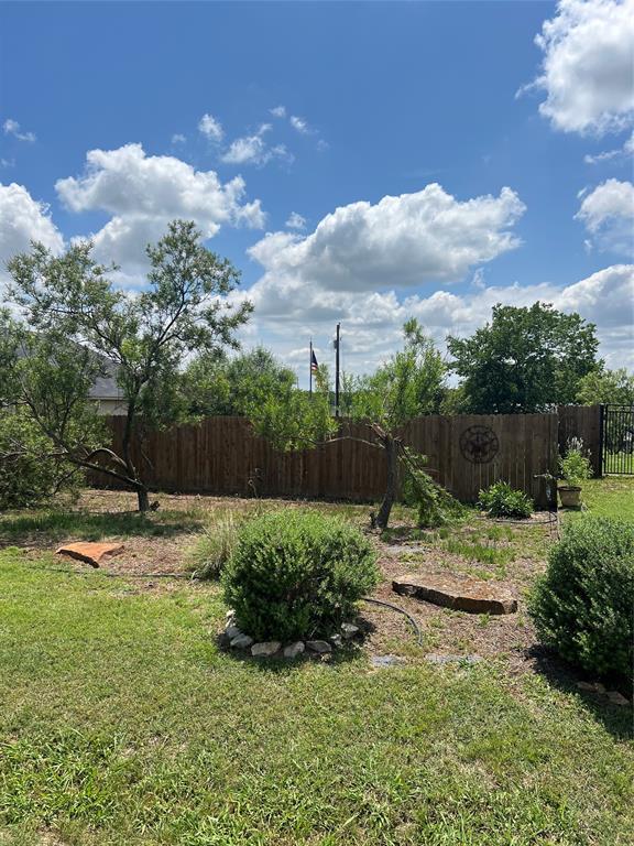 609 Mesquite Drive Rio Vista, TX 76093 - Photo 1 of 1 a backyard of a house with lots of green space