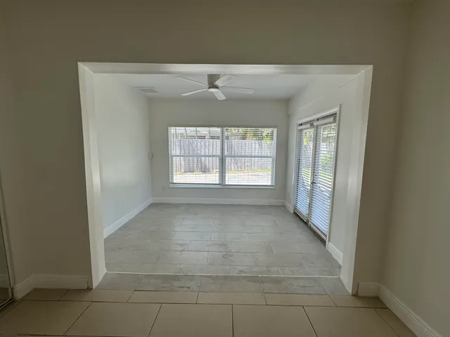 a view of an empty room with a window