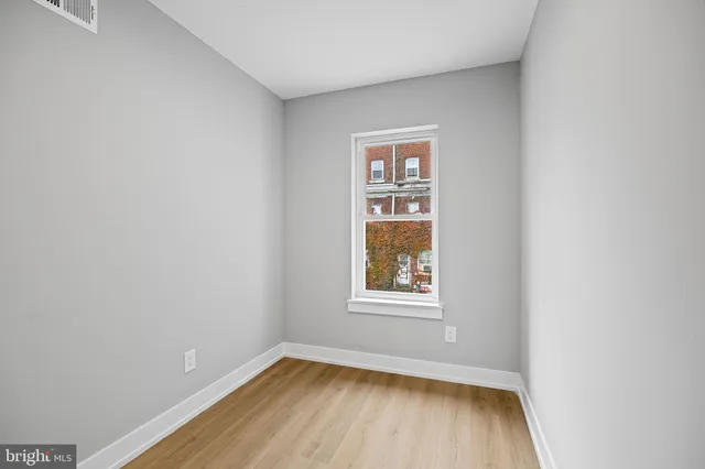 a bathroom with a tub a sink and a mirror