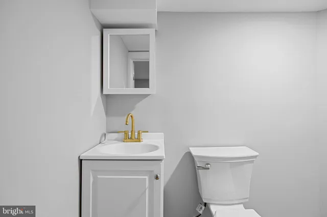 front view of a house with a cars parking space