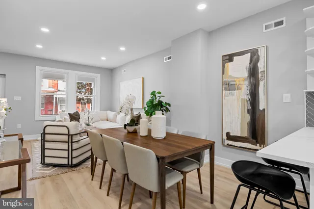 a dining room with furniture and window