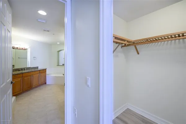 a bathroom with a granite countertop sink and shower