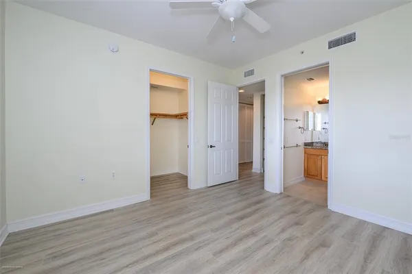 a bathroom with a granite countertop toilet a sink and a bathtub