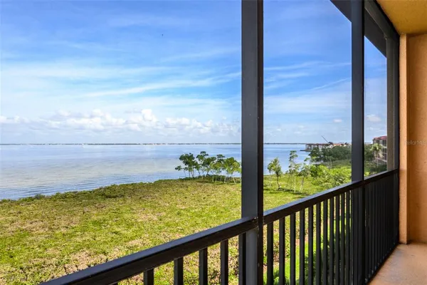 a view of a swimming pool with furniture