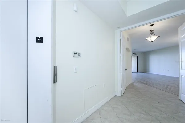 a view of a room with window and wooden floor