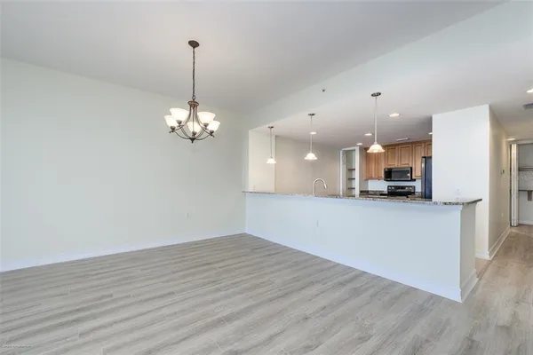 a view of a kitchen with a dishwasher and cabinets
