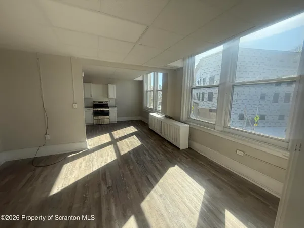 a view of an empty room and window