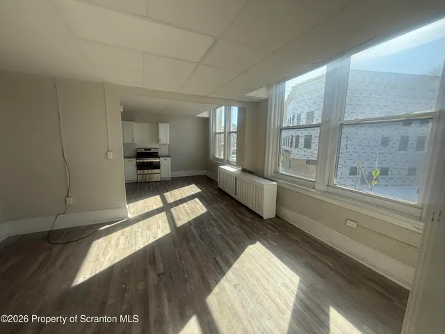 a view of an empty room and window