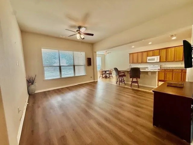 a view of a livingroom with furniture and a flat screen tv