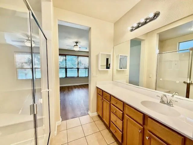 a view of a house with swimming pool and sitting area