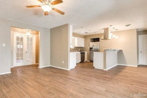 a view of a kitchen with wooden floor
