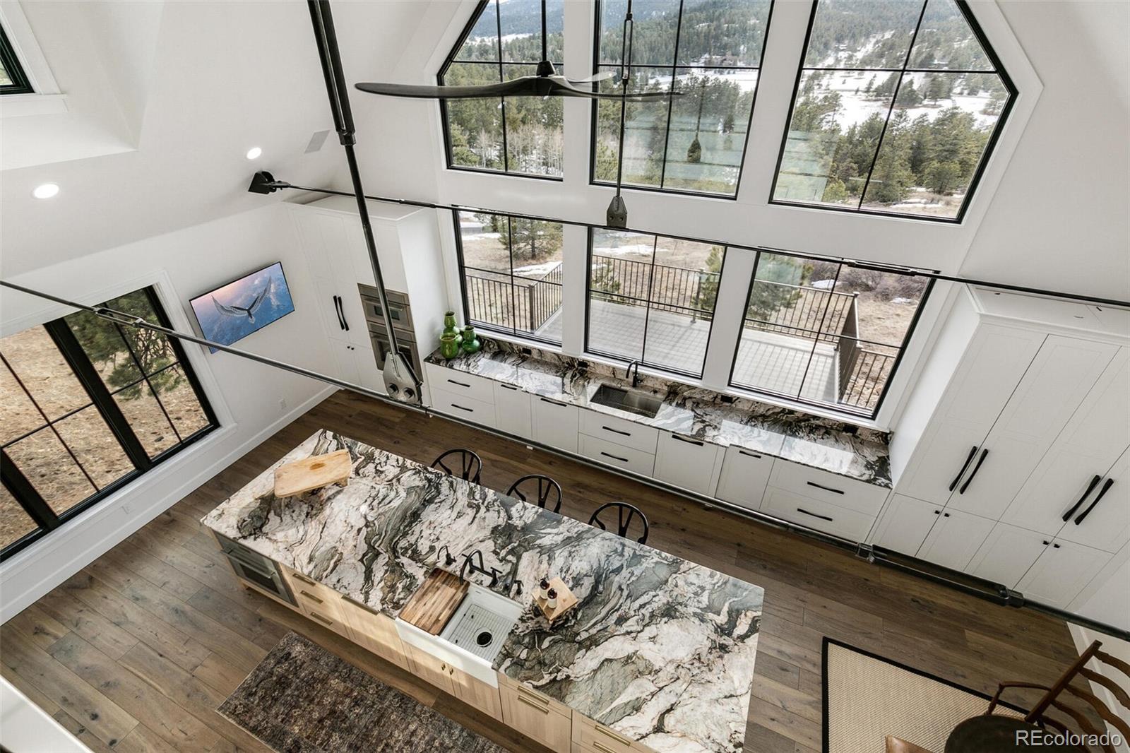 a view of an entryway with wooden floor