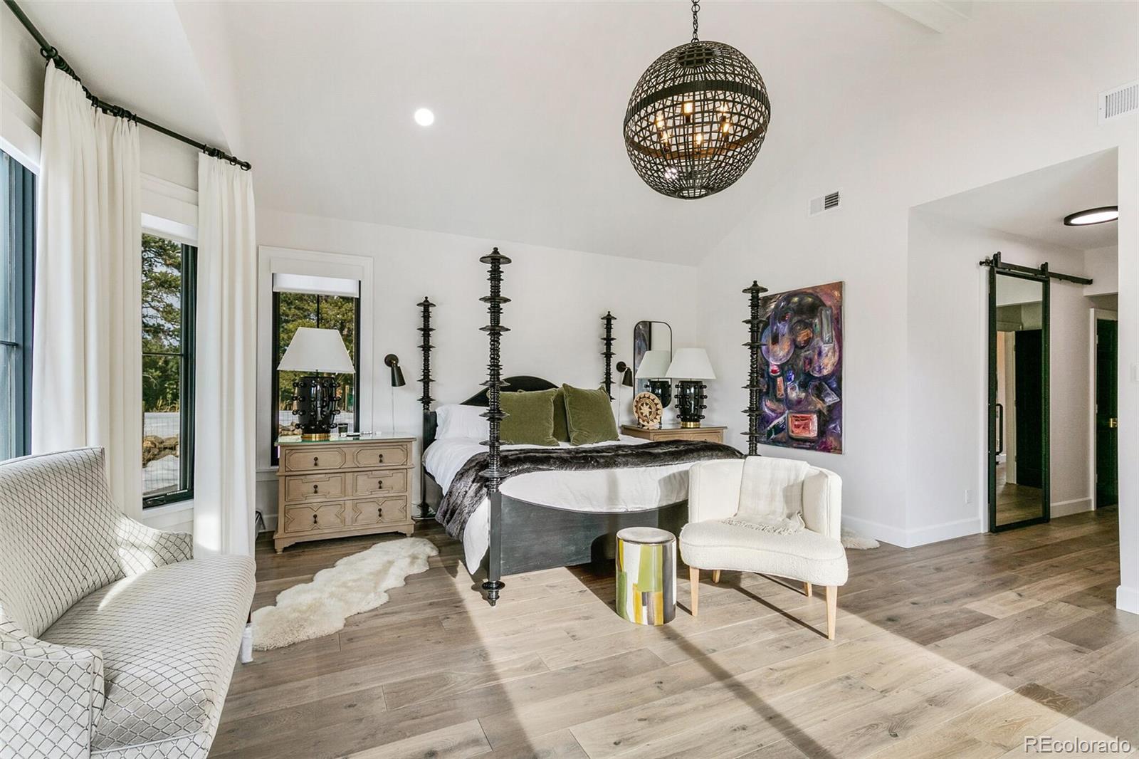 1128 County Road 65 Evergreen, CO 80439 - Photo 14 of 40 a living room with furniture a clock and a view of dining room