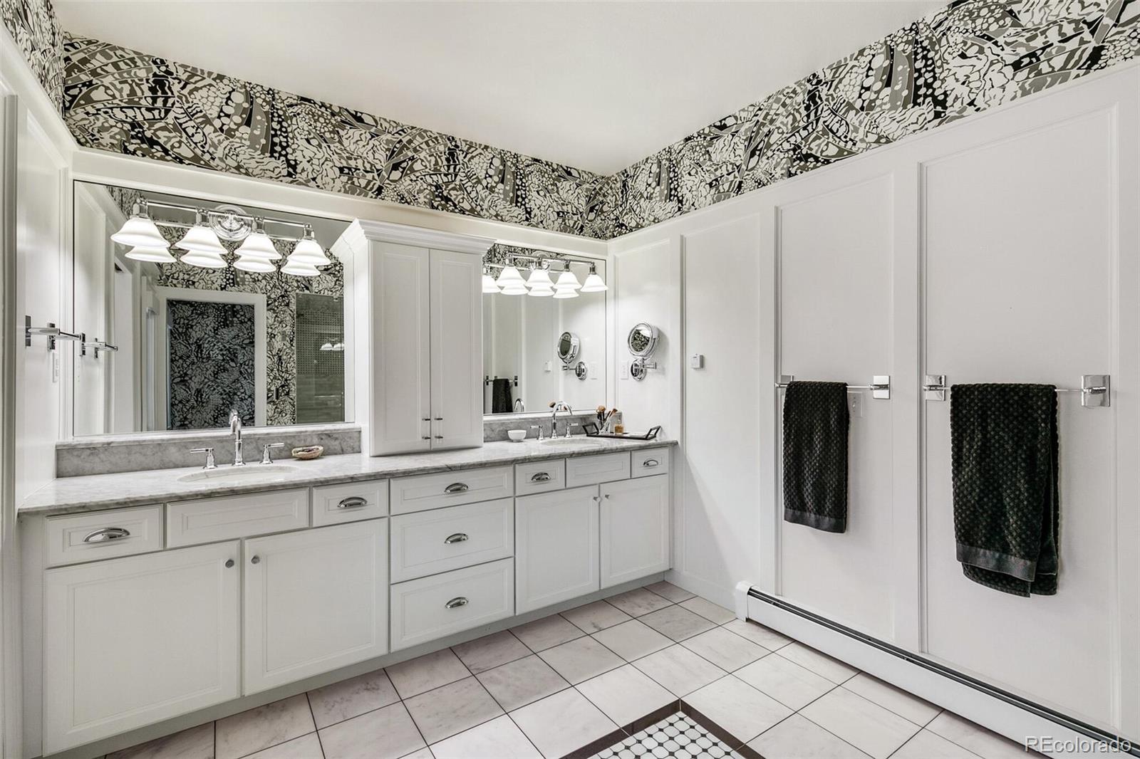 1128 County Road 65 Evergreen, CO 80439 - Photo 15 of 40 a large white kitchen with a sink and refrigerator