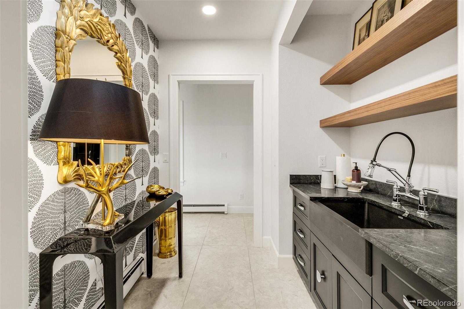 1128 County Road 65 Evergreen, CO 80439 - Photo 17 of 40 a kitchen with a sink and a stove top oven