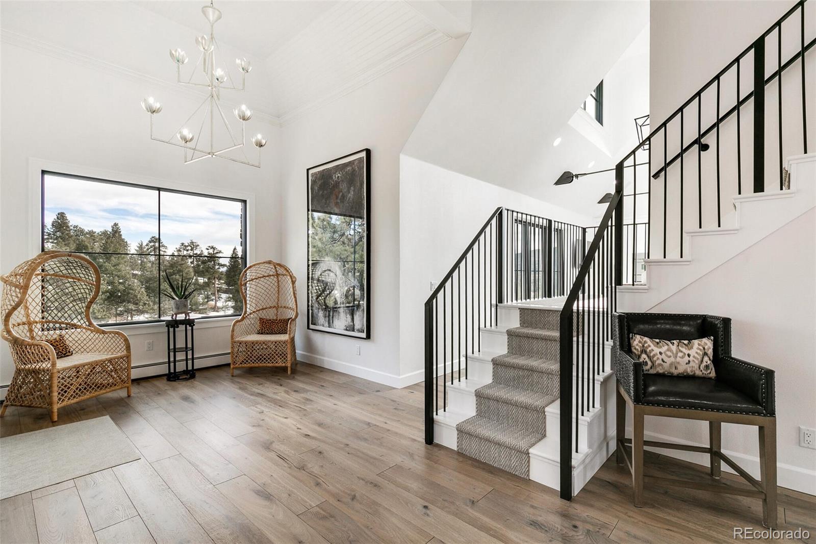1128 County Road 65 Evergreen, CO 80439 - Photo 19 of 40 a view of entryway livingroom and hall with wooden floor