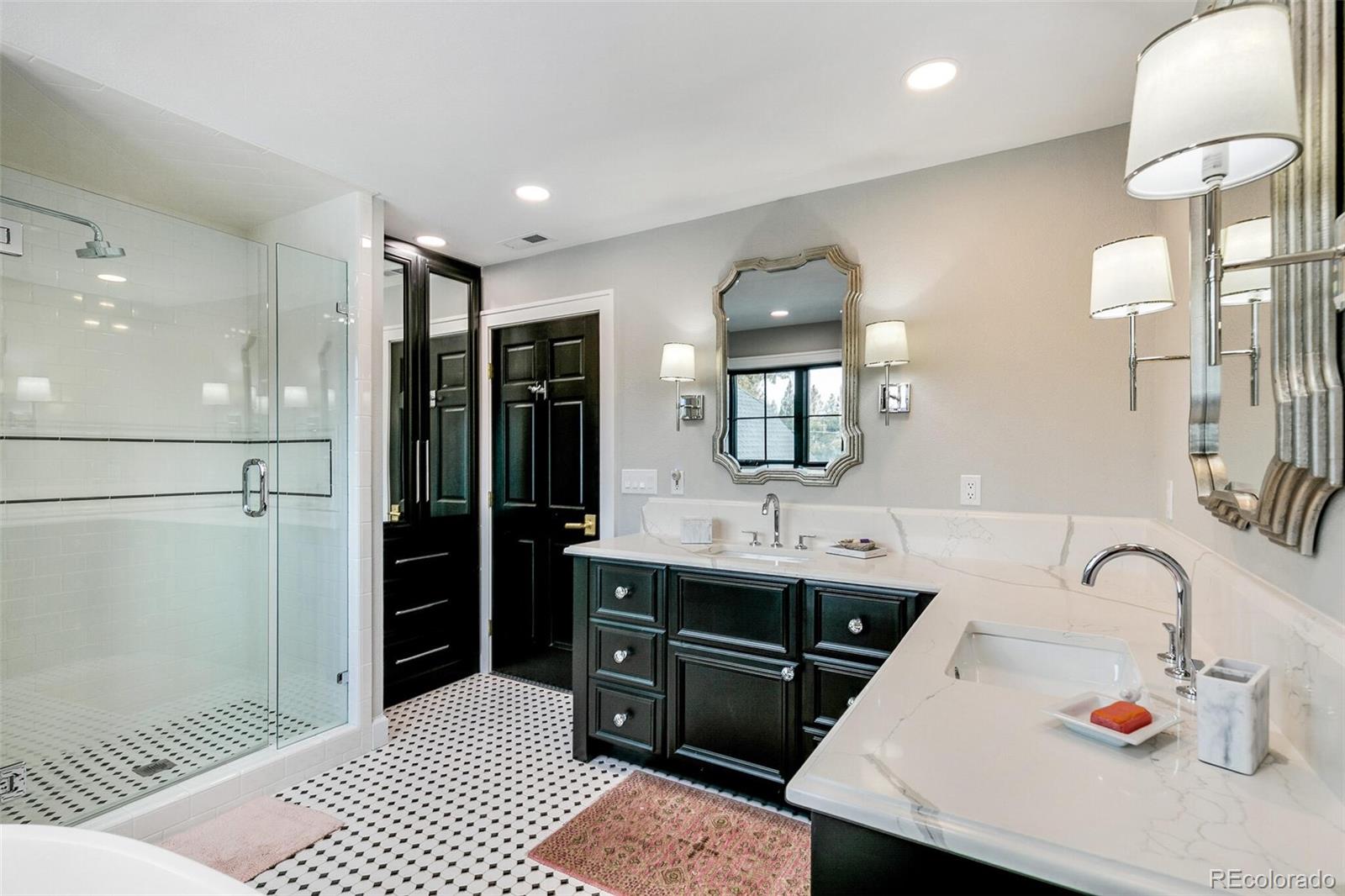1128 County Road 65 Evergreen, CO 80439 - Photo 25 of 40 a bathroom with a sink and a mirror