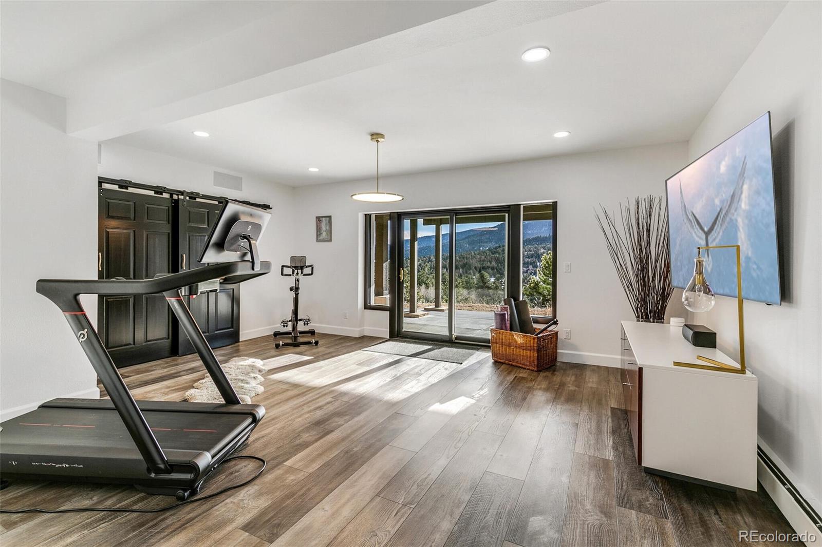 1128 County Road 65 Evergreen, CO 80439 - Photo 26 of 40 a view of a room with gym equipment and a large window