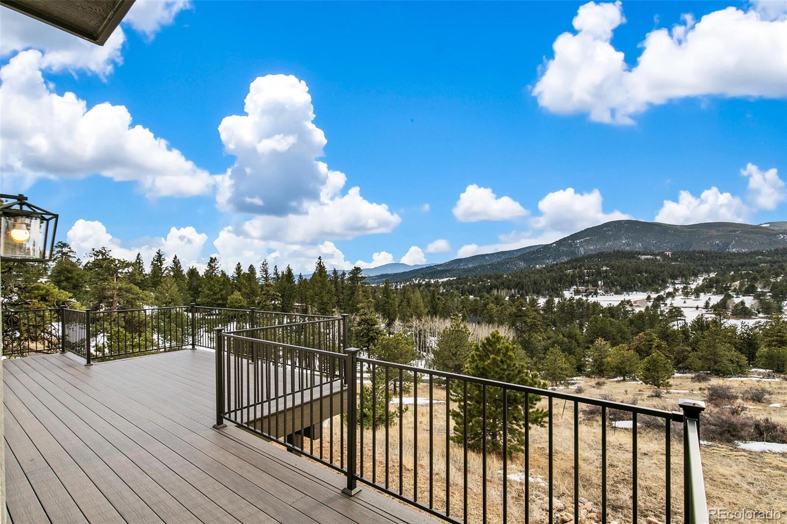 1128 County Road 65 Evergreen, CO 80439 - Photo 31 of 40 a view of a balcony with a staircase