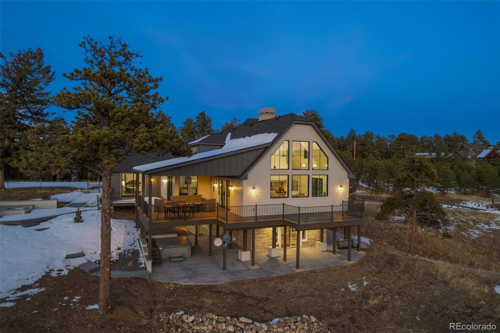 1128 County Road 65 Evergreen, CO 80439 - Photo 35 of 40 a view of a house with a swimming pool