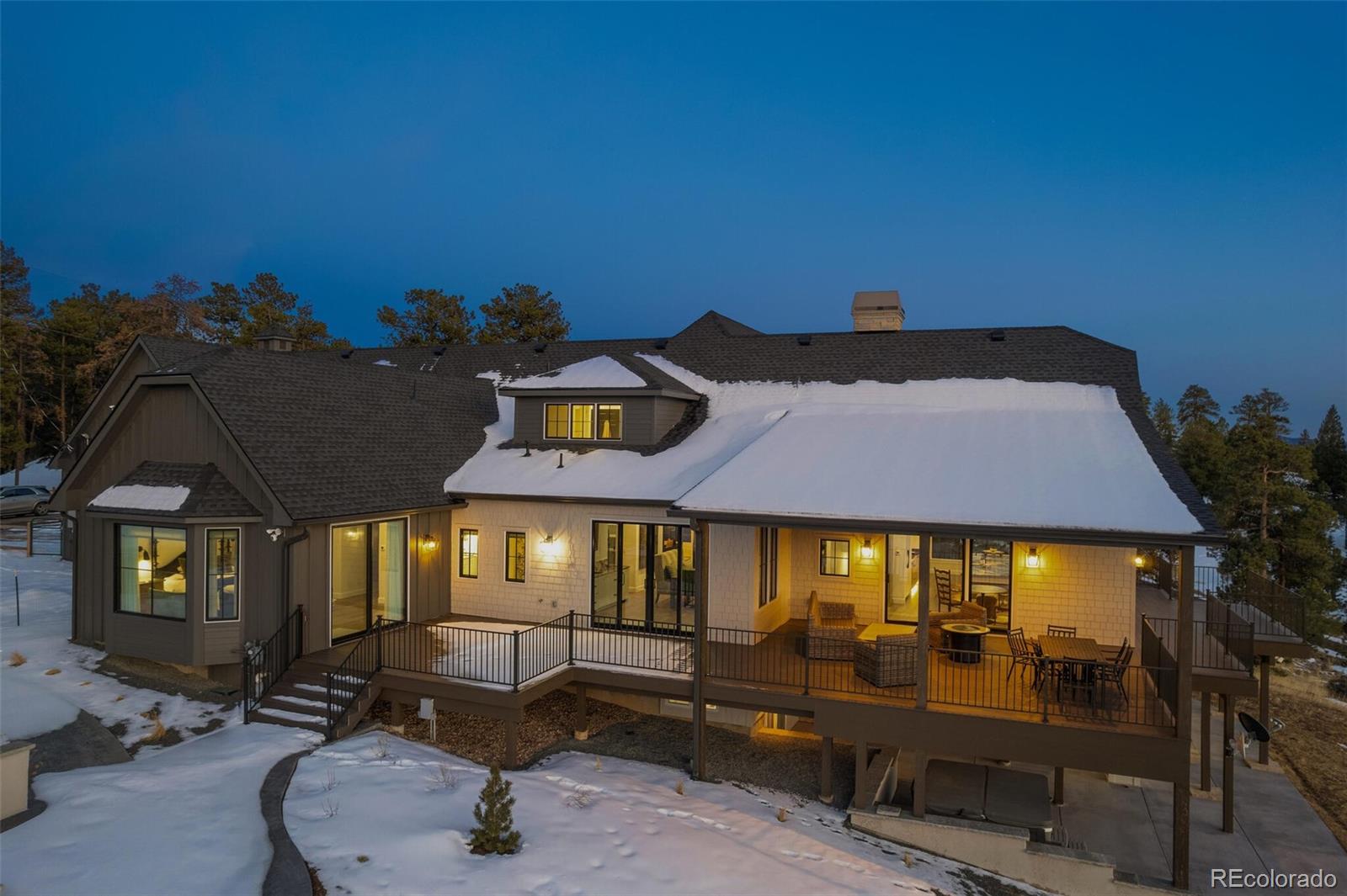 1128 County Road 65 Evergreen, CO 80439 - Photo 36 of 40 a front view of a house with sitting area