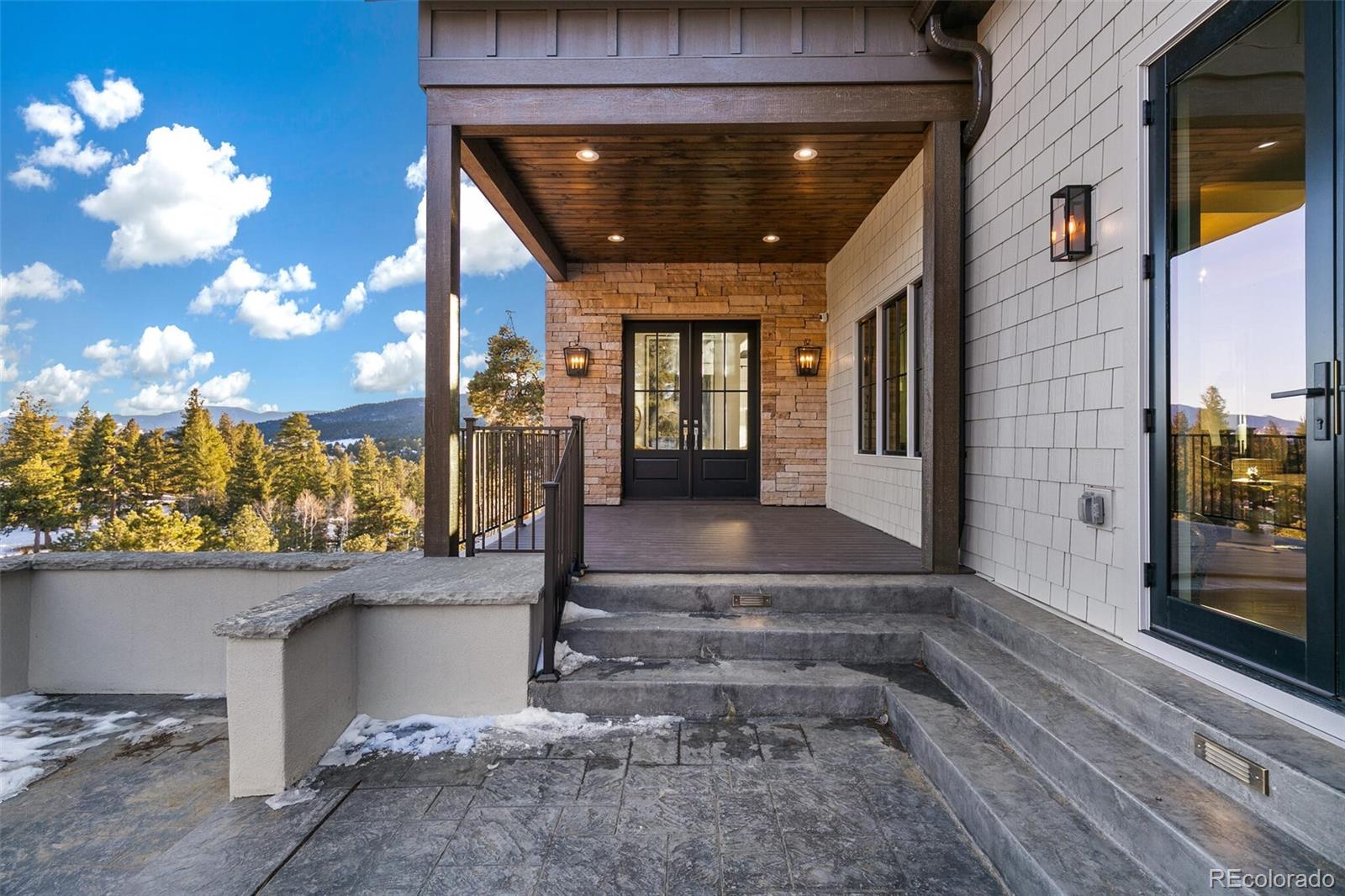 1128 County Road 65 Evergreen, CO 80439 - Photo 6 of 40 a view of a entryway door front of house