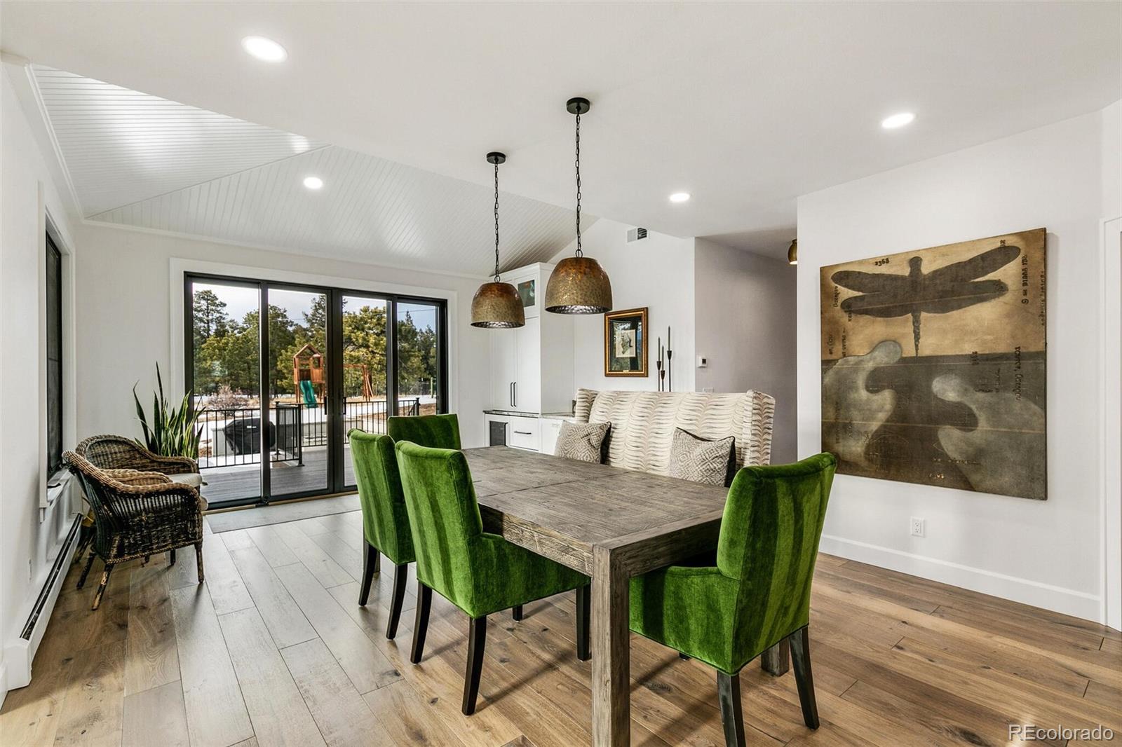 1128 County Road 65 Evergreen, CO 80439 - Photo 10 of 40 a view of a dining room with furniture window and outside view