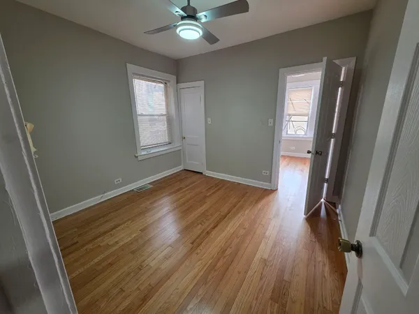 a view of a room with wooden floor and staircase