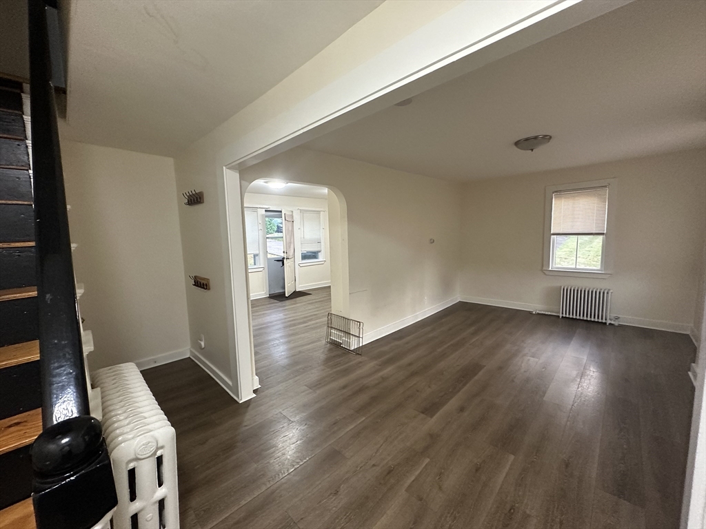 1024-1026 Waverly Street, Unit 3 Framingham, MA 01702 - Photo 11 of 22 wooden floor in an empty room with a window