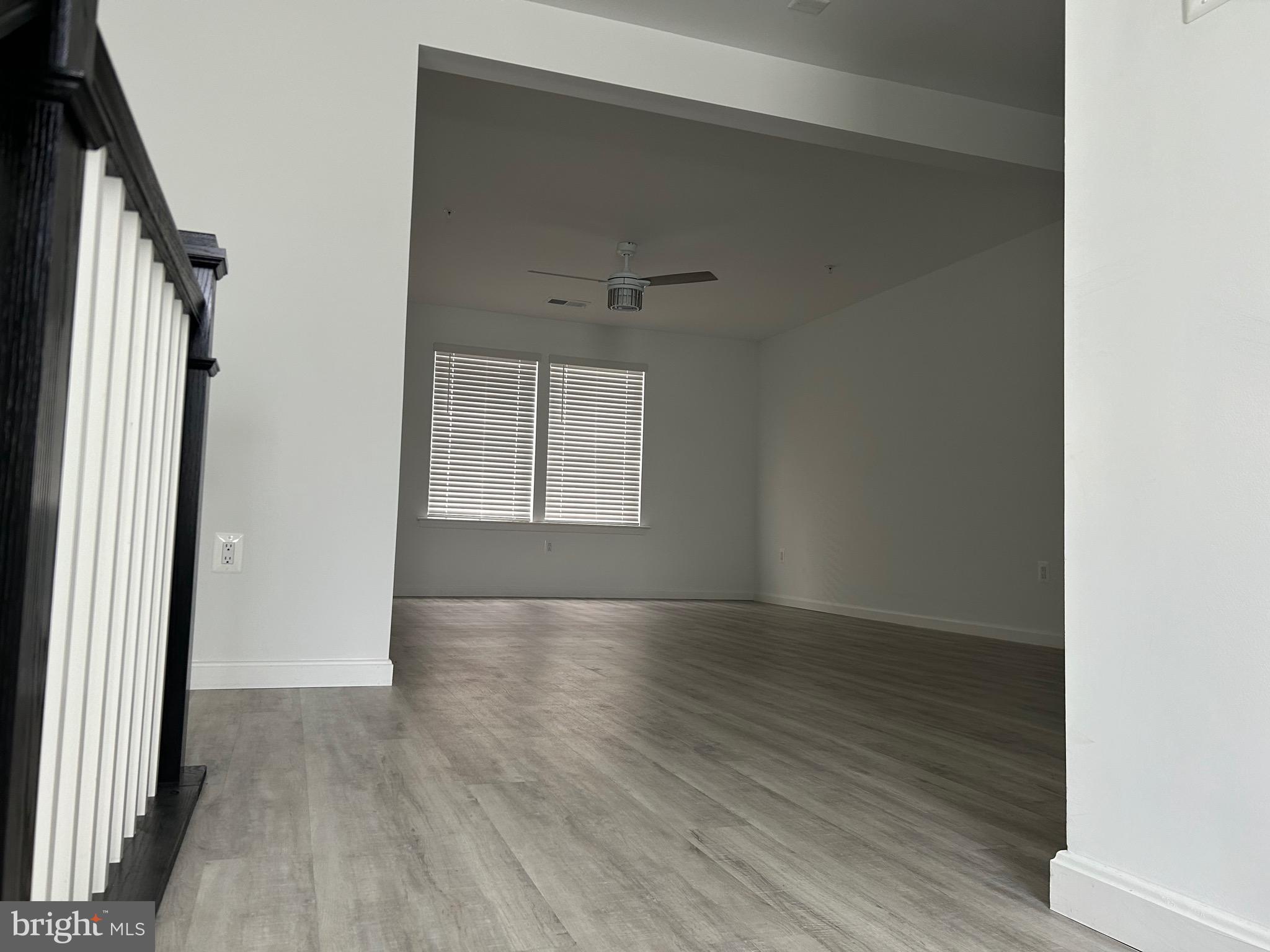2703 Grasshopper Drive Odenton, MD 21113 - Photo 10 of 14 an empty room with wooden floor and windows