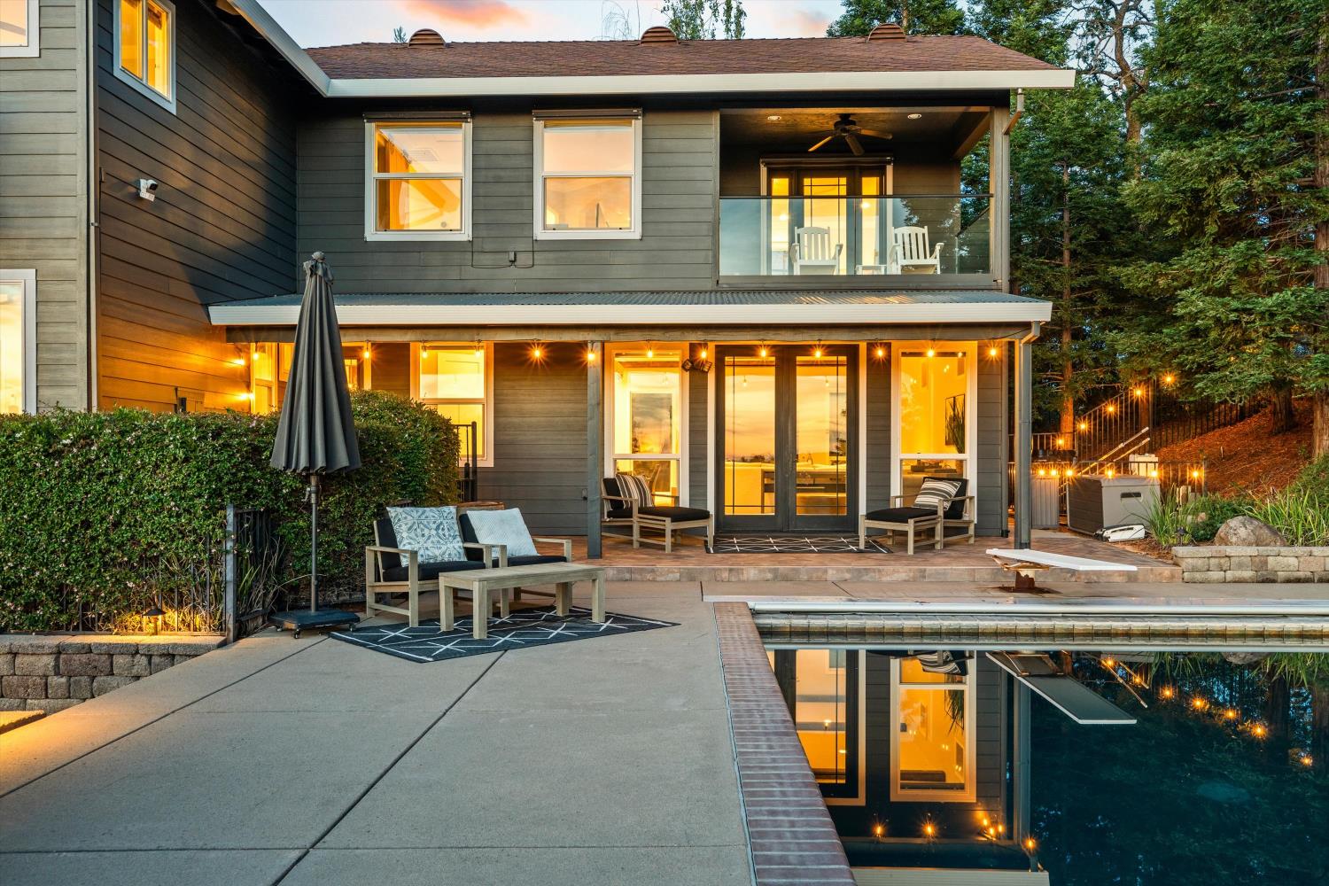 7380 Ridge Road Newcastle, CA 95658 - Photo 88 of 97 a view of swimming pool with outdoor seating and trees in the background