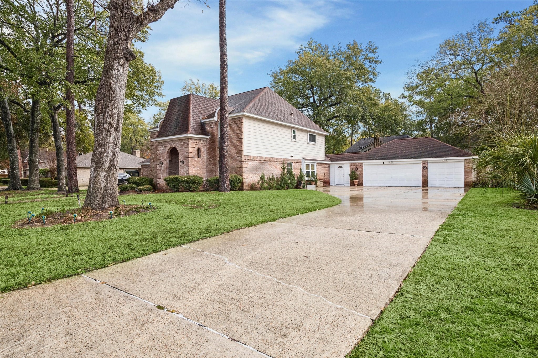 6723 Apple Valley Lane Houston, TX 77069 - Photo 3 of 25 a front view of a house with a yard and garage