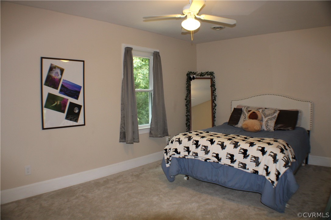 504 Rivers Bend Circle Chester, VA 23836 - Photo 27 of 50 a bedroom with a bed and window