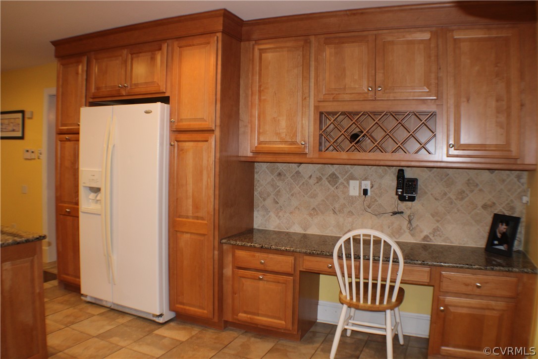 504 Rivers Bend Circle Chester, VA 23836 - Photo 10 of 50 a kitchen with granite countertop cabinets and window
