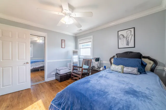 a bedroom with furniture and a window
