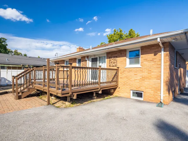 a view of a house with roof deck front of house