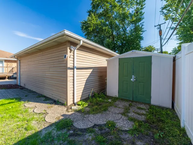 a front view of a house with garden and porch