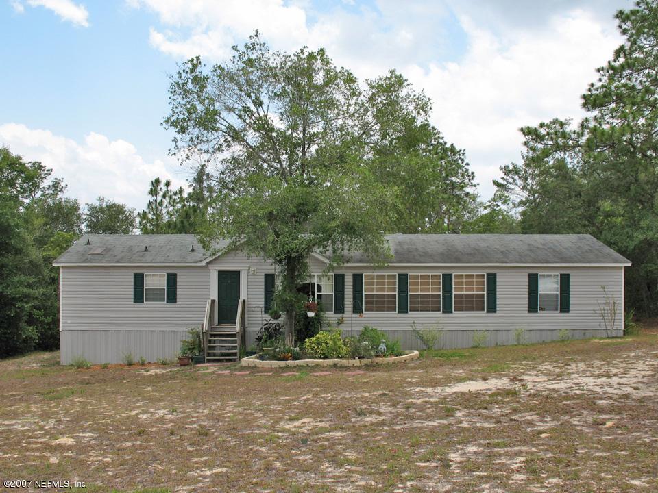 7260 Gas Line Road Keystone Heights, FL 32656 - Photo 1 of 5 front view of a house with a yard