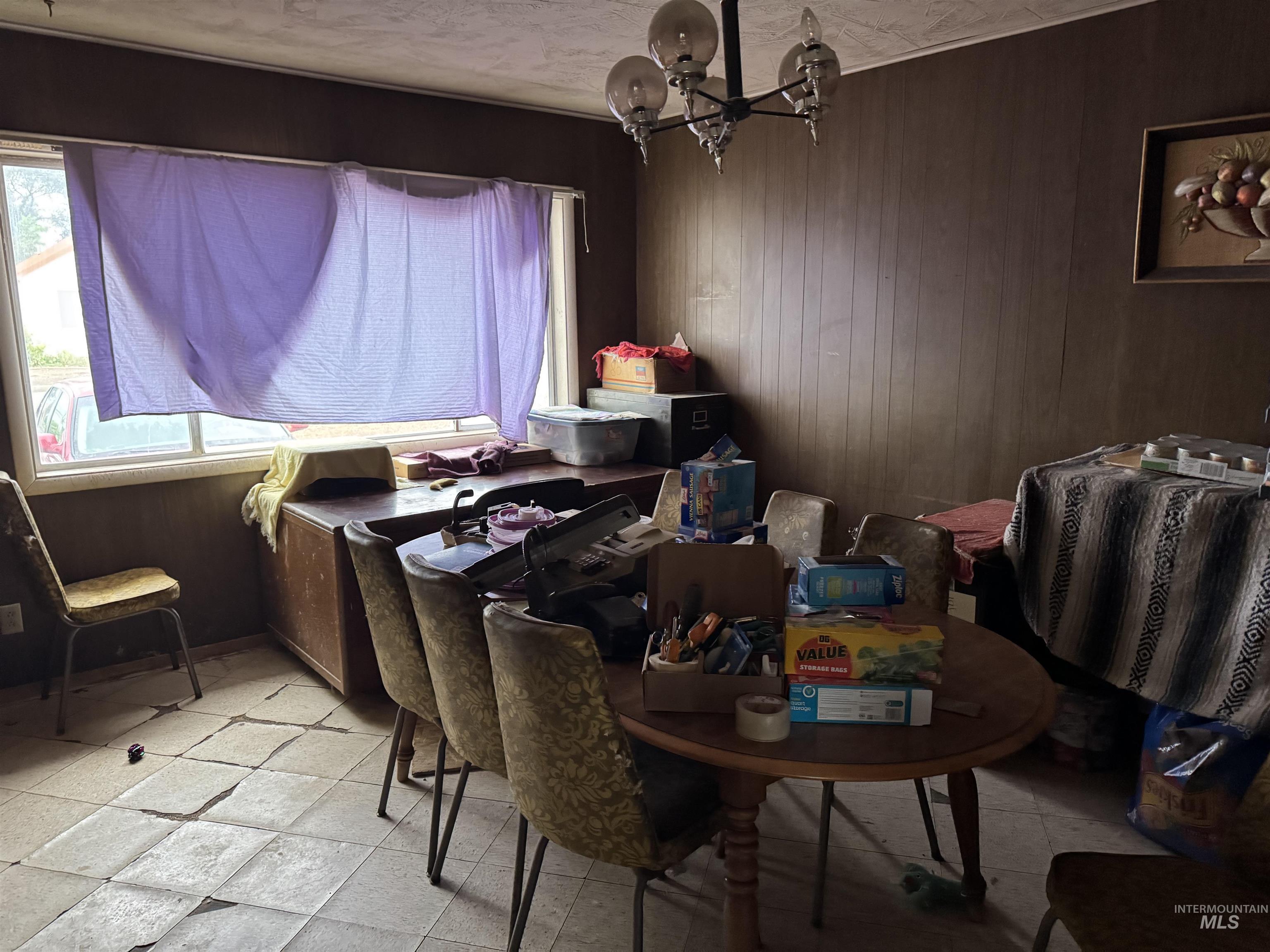 416 North 2nd Street Nyssa, OR 97913 - Photo 13 of 24 Dining space with wooden walls and a chandelier