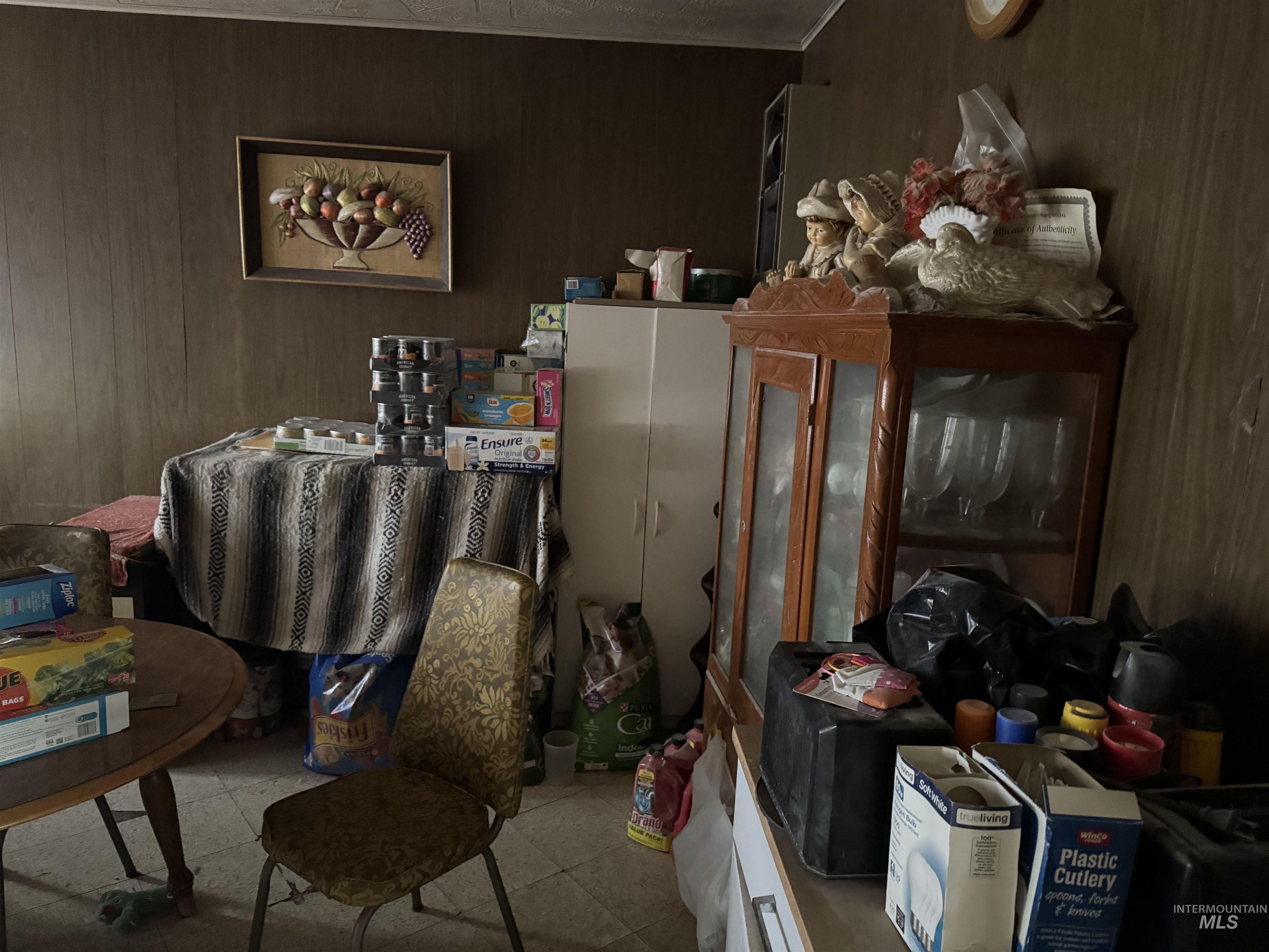 416 North 2nd Street Nyssa, OR 97913 - Photo 14 of 24 Miscellaneous room with wooden walls and tile patterned floors
