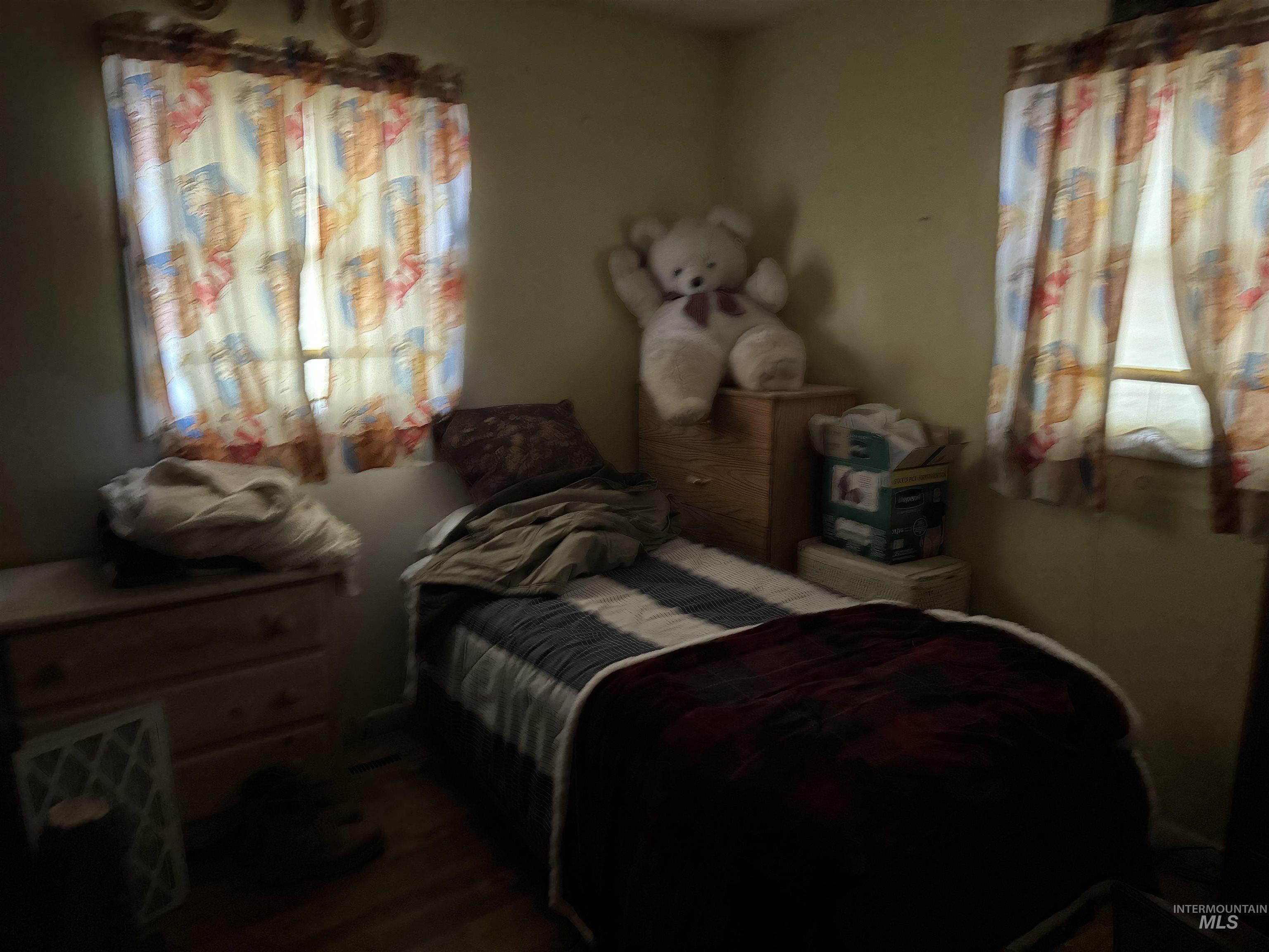416 North 2nd Street Nyssa, OR 97913 - Photo 18 of 24 Bedroom featuring dark wood-style flooring