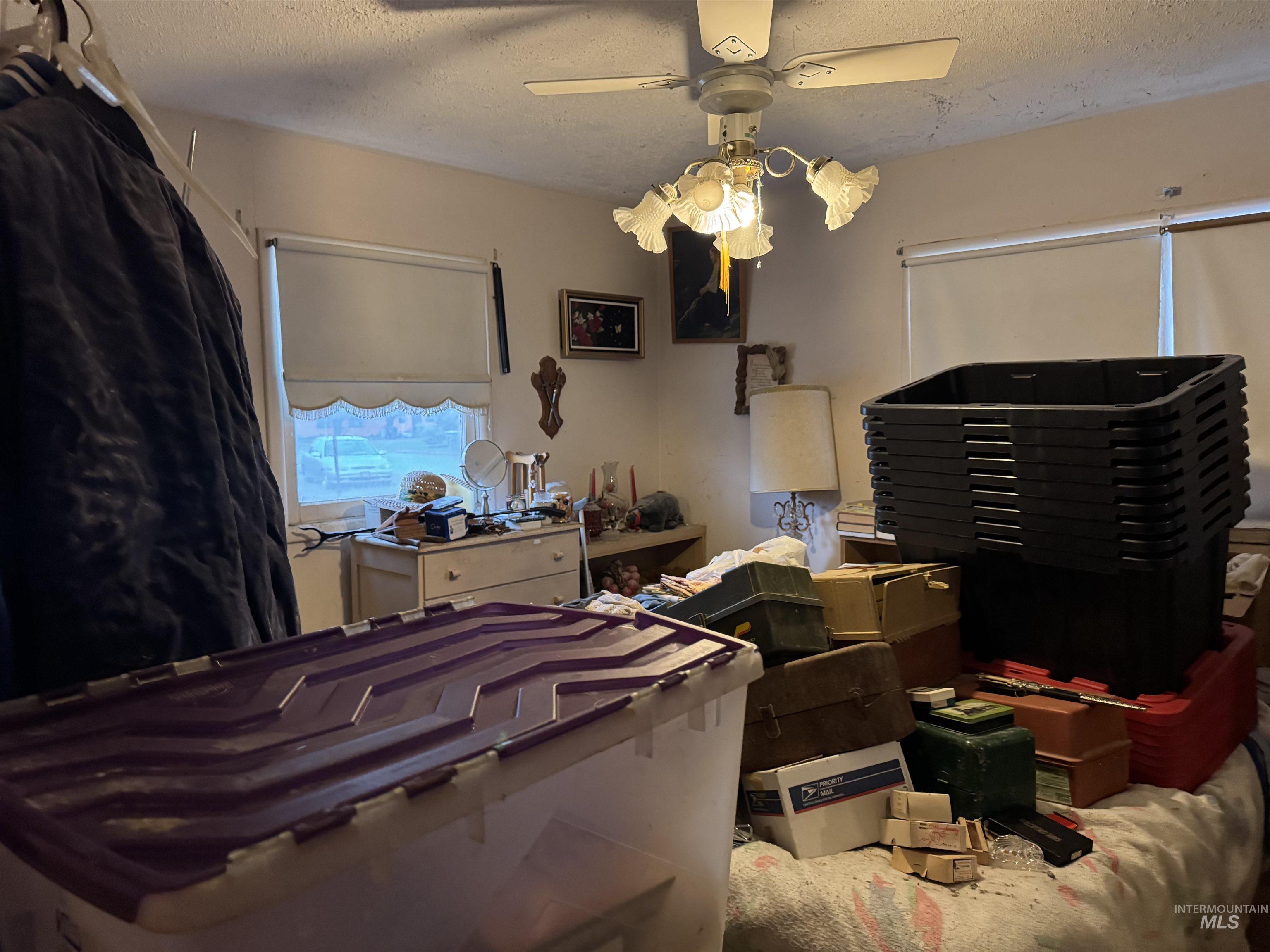 416 North 2nd Street Nyssa, OR 97913 - Photo 20 of 24 Bedroom featuring a textured ceiling and a ceiling fan