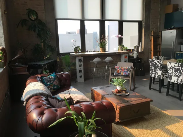 a kitchen with stainless steel appliances a stove a sink and a refrigerator