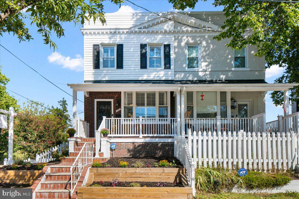 6411 7th Street Northwest Washington, DC 20012 - Photo 1 of 35 a front view of a house with a garden